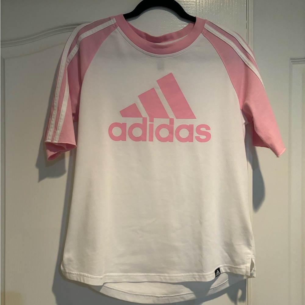 Adidas white t-shirt with pink logo and pink stripes on the sleeves